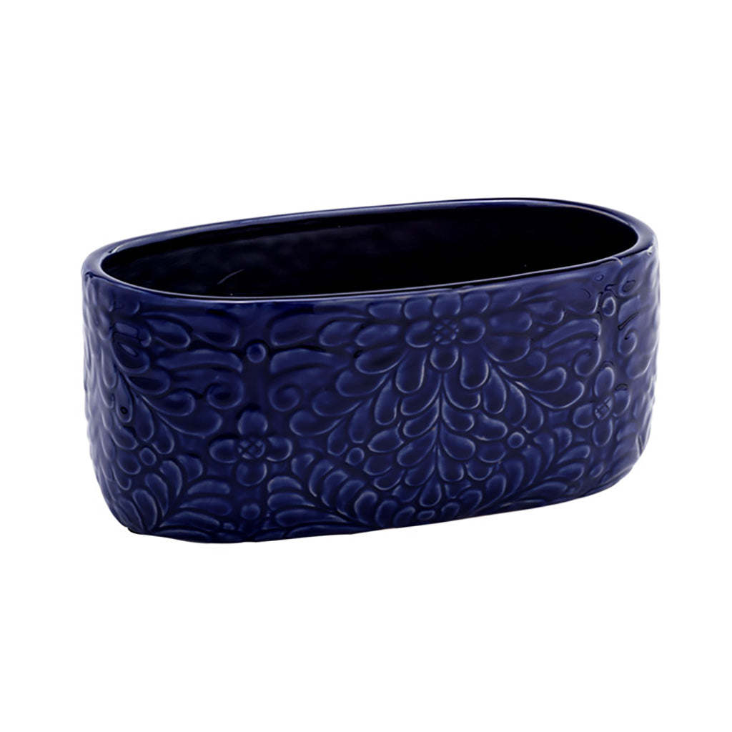 Elevate your gardening experience with our stunning Cobalt Oval Planter. The gorgeous deep blue color and intricate accents will make a statement in any space, adding a touch of style and sophistication. With dimensions of 4.5" L x 10" W x 4.25" H, this planter is the perfect size for your favorite plants, ensuring they have enough space to thrive.&nbsp;