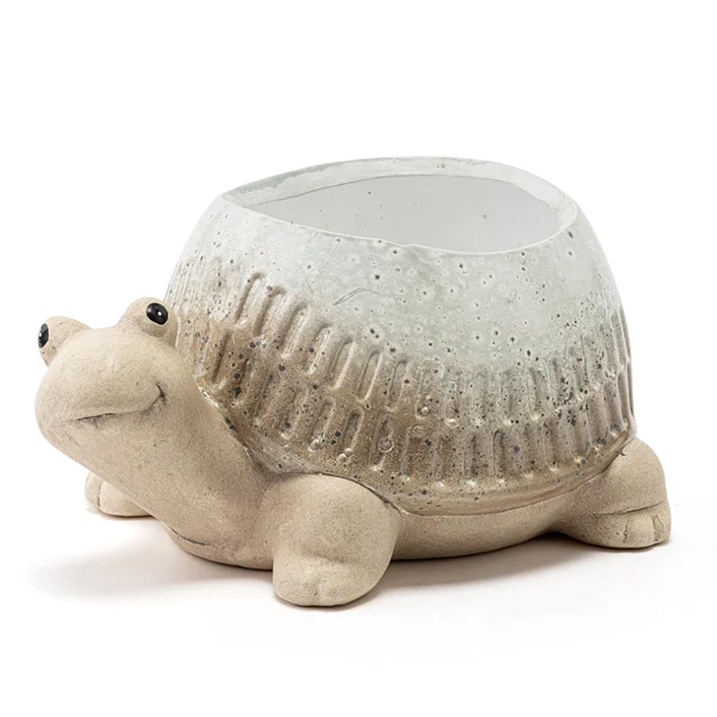 Add a touch of whimsy to your garden with this charming ceramic Ribbed Turtle Planter. Its unique design and small size make it the perfect addition to any space. Measures 3.5" L x 3.5" W x 3.25"H.