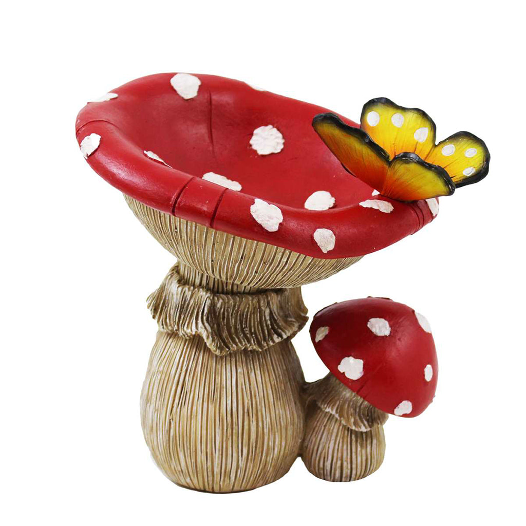 This charming Mushroom Butterfly Bird Bath, made of polyresin, features a delicate butterfly resting on the edge. A lovely addition to any garden, providing a peaceful spot to observe wildlife. Measures 7.5x6.5x7".