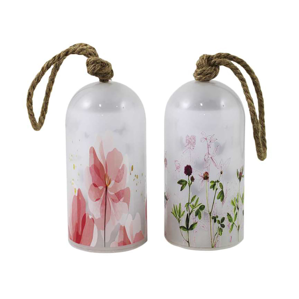 Create an inviting atmosphere in your outdoor space with these LED frosted glass bottle lights. Featuring a flower pattern and rope handle, these lights can be hung from a tree in your garden or along a deck railing. Available in two styles (sold separately) and measuring 3.5x3.5x7.5", they are the perfect way to add charm to your outdoor décor.
