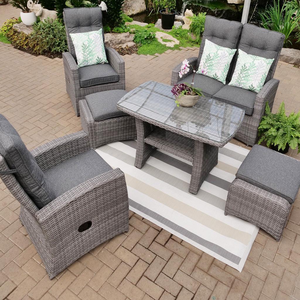 Unwind in style with this versatile dining set that includes all you need for a cozy night in. With two reclining chairs and footstools, along with a loveseat and table, you'll have plenty of space to relax with friends and family. Plus, the included cushions ensure you can comfortably lounge for hours on end.
