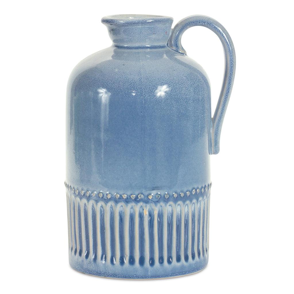 This ceramic jug adds a touch of charm to any home décor. Its rustic style and delicate details make it a timeless piece you'll love for years to come. Stands 8.75 inches tall.