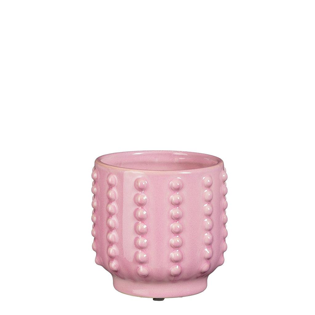 Inspired by natural beauty and minimalist design, this lilac Boaz Ceramic Pot is the perfect addition to any home. Its soft pink hue and understated accents effortlessly elevate any room, making it a must-have for both plant lovers and interior enthusiasts alike.
