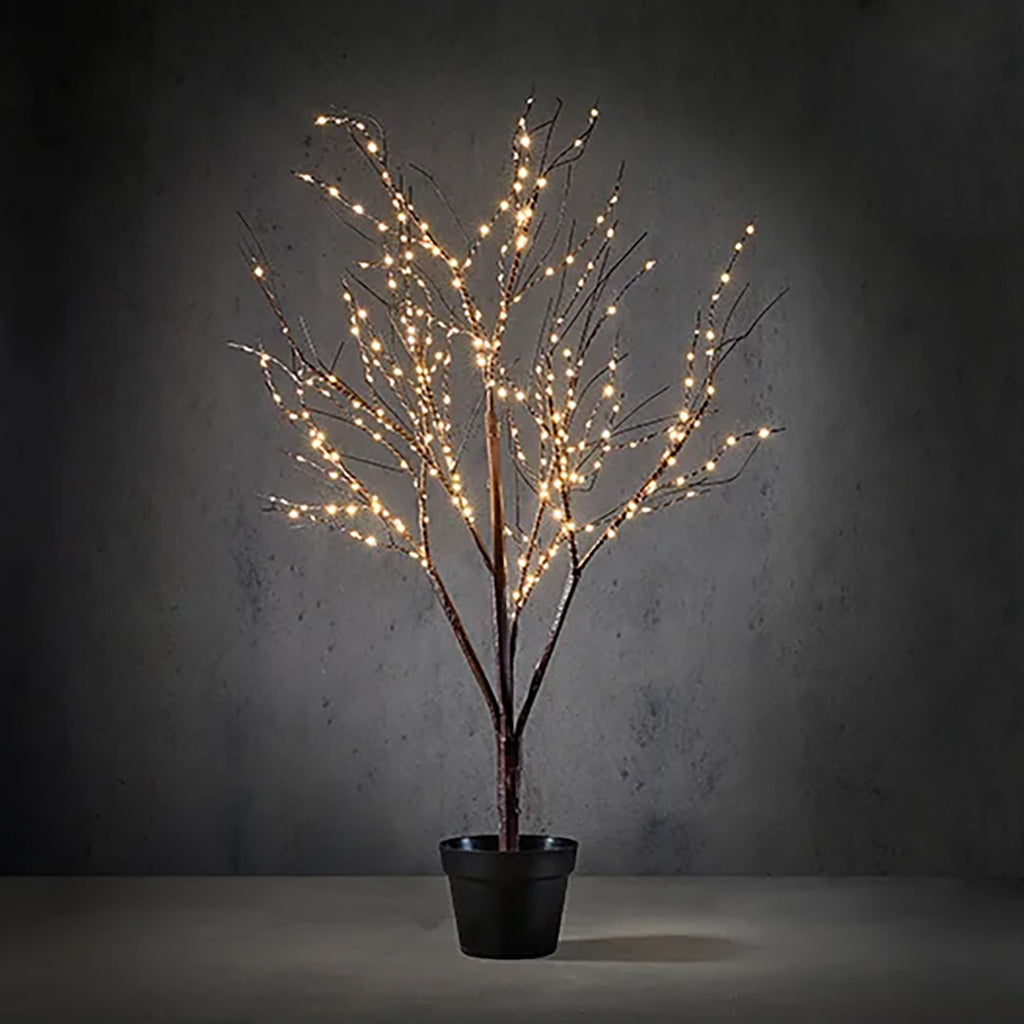 Elevate your holiday décor with this charming 4-foot Tree with Pot adorned with 300 LED classic white lights. This artificial tree comes in a rustic brown pot that adds a touch of warmth and authenticity to your space. The integrated timer function allows you to set your preferred lighting schedule, making it convenient and energy-efficient. Whether placed in your living room, foyer, or any corner of your home, this Tree with Pot serves as a festive and welcoming addition to your holiday festivities.