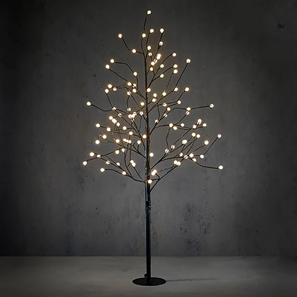 Illuminate your space with enchanting radiance using the Black Tree LED. This elegant 5-foot tree features 108 classic white LED lights, each with a convenient timer for hassle-free operation. The sleek black silhouette enhances any décor, offering a modern and sophisticated touch to your space.