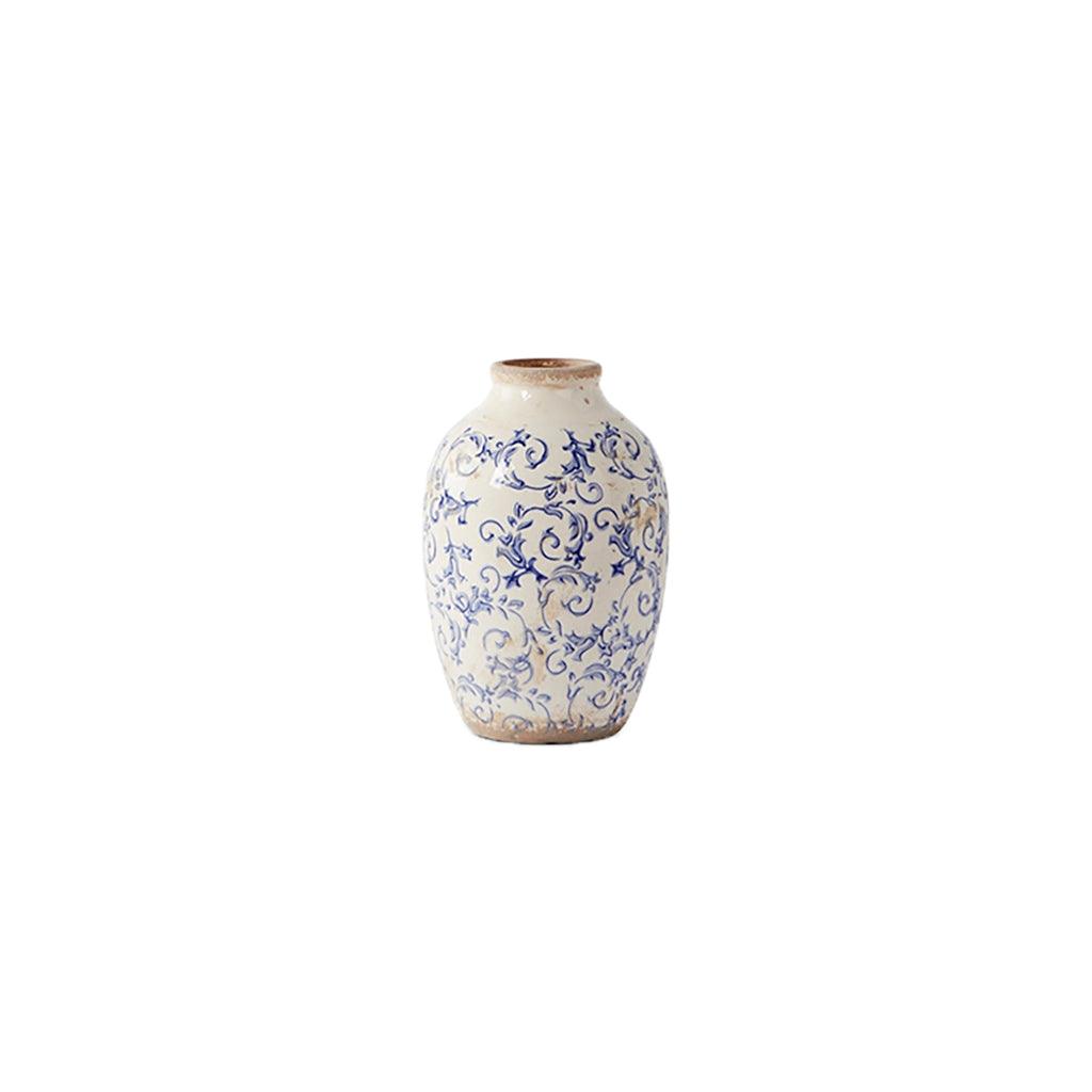 Rustic elegance Intricate blue details This vintage-inspired vase offers an elevated touch to any space with its intricate blue details and rustic elegance. Perfect for adding allure to your home décor. Measures 10in h x 6.5in w.