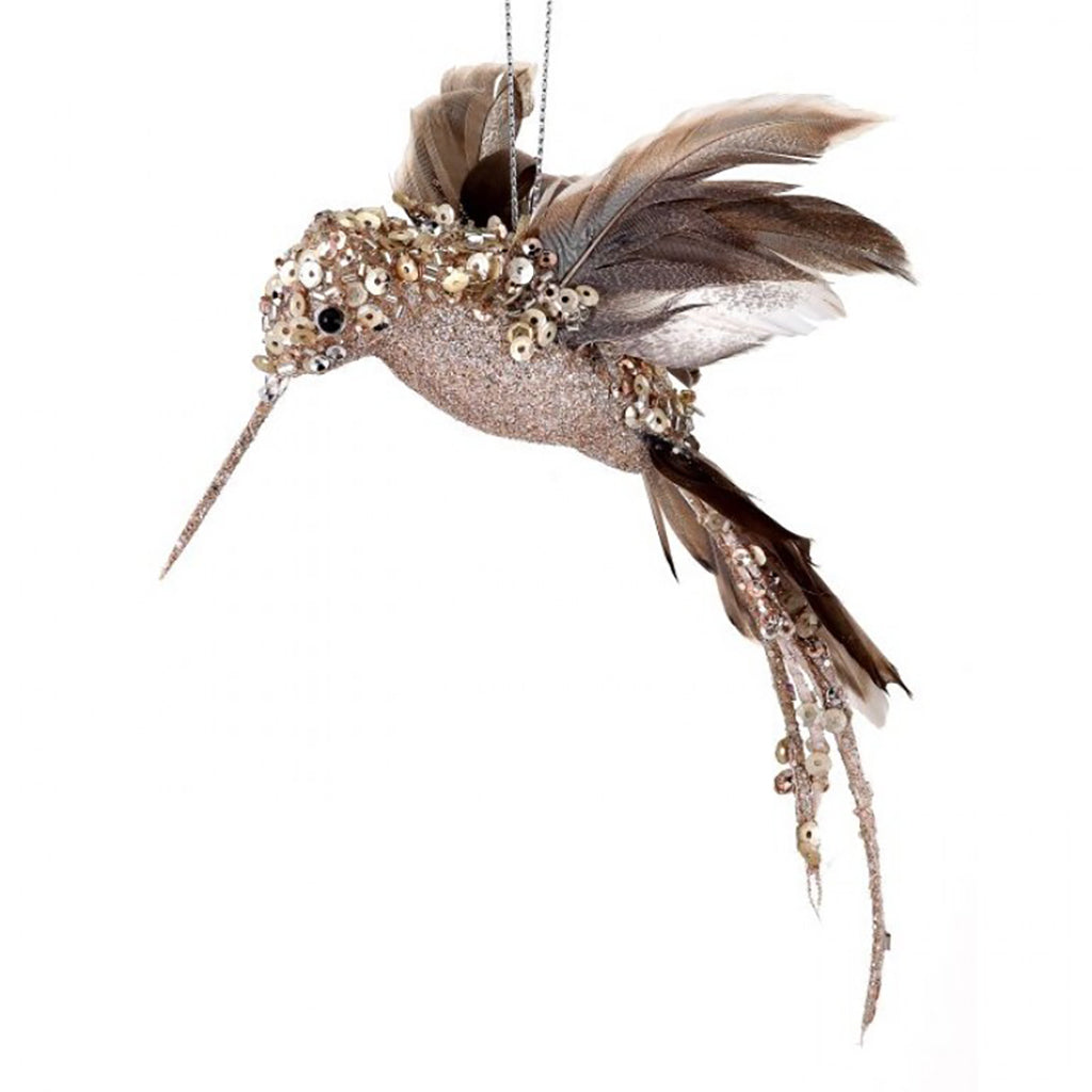 Elevate your holiday dÃ©cor with our Glitter Hummingbird Ornament, a stunning 8-inch masterpiece that brings a touch of natural luxury to your festive setting. Crafted with meticulous attention to detail, this ornament captures the grace and beauty of a hummingbird in flight, making it a captivating addition to your Christmas tree or overall seasonal dÃ©cor.