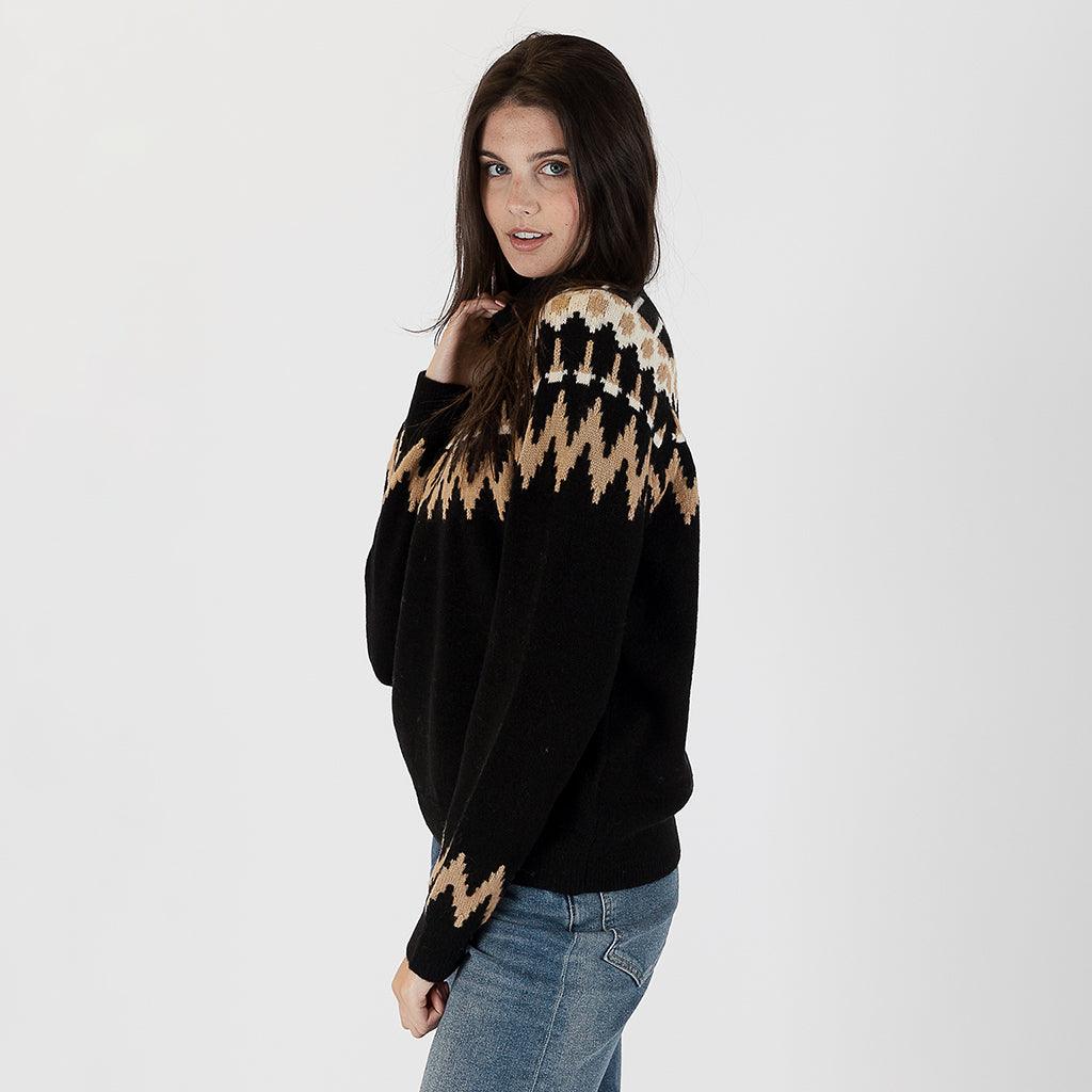  This sweater boasts a timeless Fairisle design that exudes warmth and style. 