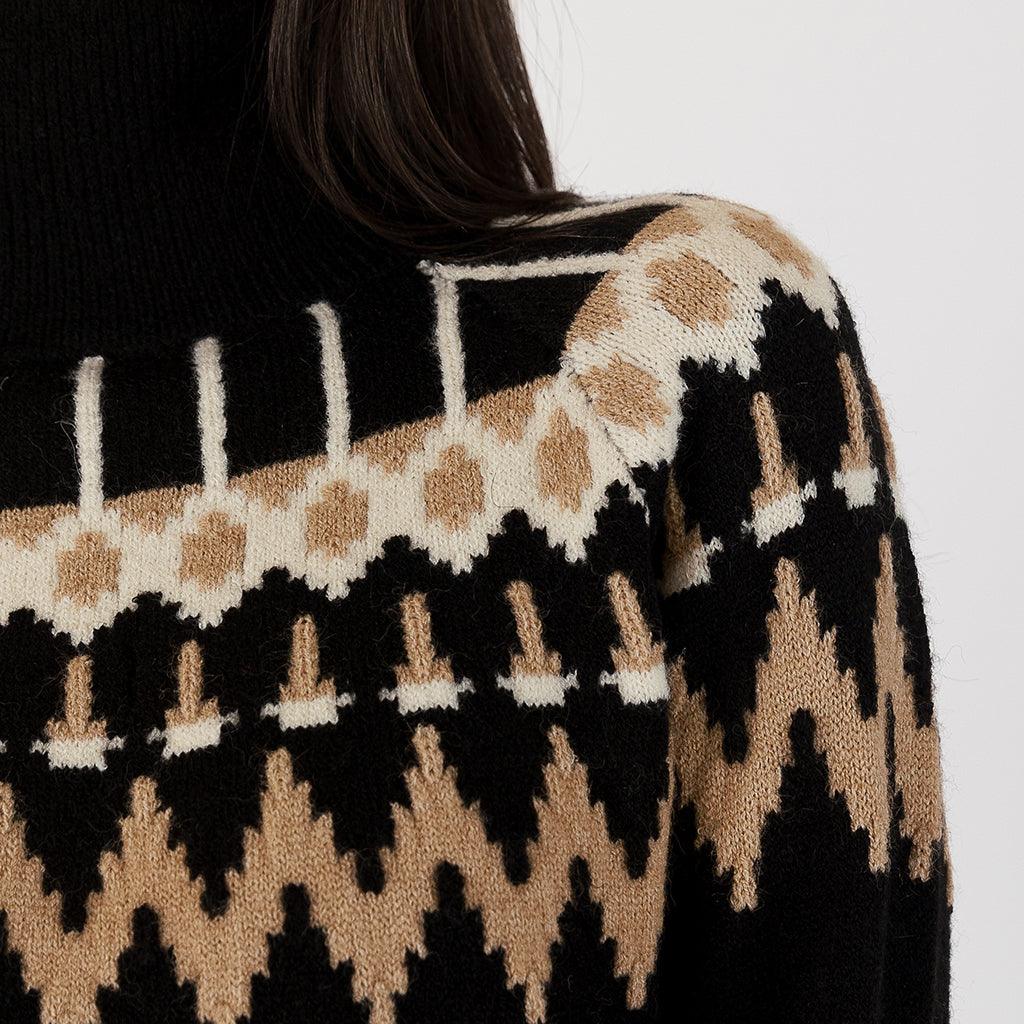 Crafted with high-quality materials, this sweater guarantees both durability and softness against your skin. Embrace the seasonal charm of Fairisle while enjoying the versatility of black and multi-colored accents that effortlessly match various outfits. 