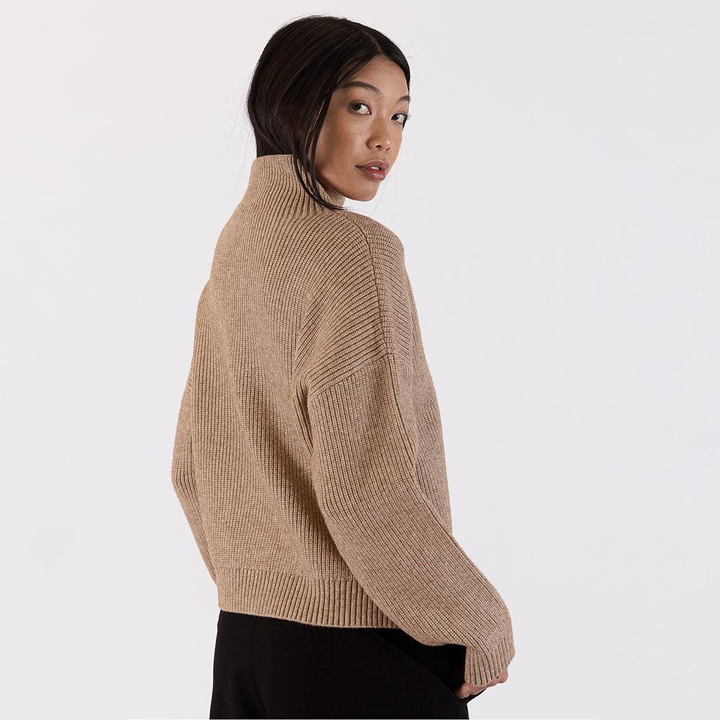 Crafted with attention to detail and quality, this sweater is an autumn essential that seamlessly complements various outfits. 