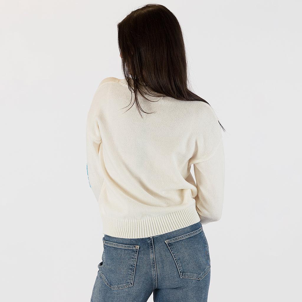 This sweater effortlessly combines classic comfort with a burst of modern flair. The intricate detailing of each flower adds depth and personality to the piece, making it a true standout in your collection. Crafted with meticulous attention to quality and comfort, this sweater boasts a luxurious softness that feels as good as it looks. 