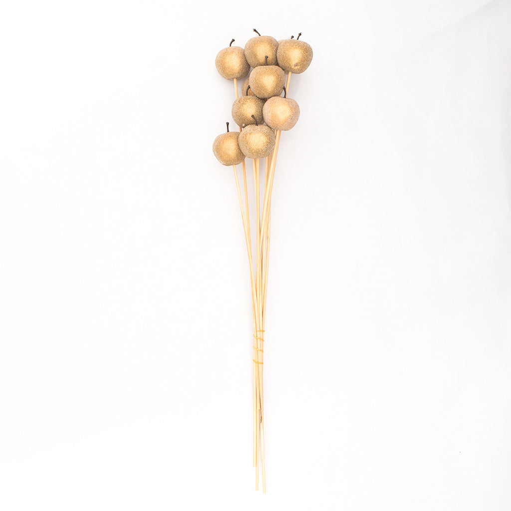 Elevate your décor with this set of 10 Sugar Apples on Stem in Gold, a luxurious addition to any setting. Crafted with attention to detail, these artificial sugar apples feature a lustrous gold finish that exudes opulence and sophistication.