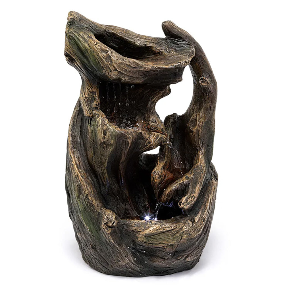 Get lost in the natural serenity of this stunning water feature. The Driftwood Water Fountain transforms any space into a calming oasis with its gentle flowing water and rustic charm. Measures 8" L x 7.5" W x 13.75" H.