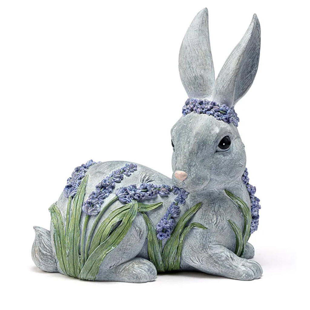 Perfect for adding a touch of charm to any room in your home! This adorable bunny boasts a beautiful lavender flower design and is made of sturdy, long-lasting resin. Measures 9" L x 10.25" H.