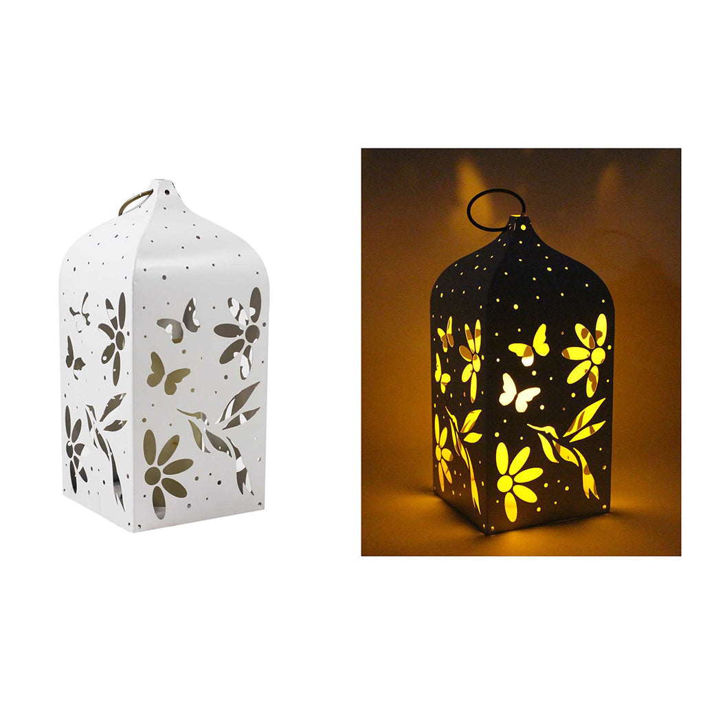 Experience the convenience of always having light on hand with the White Hummingbird Lantern. No more scrambling for candles or searching for outlets during a power outage. Simply grab your lantern and go! Plus, the sleek LED design adds a touch of style to any room. Measures 5.5x5.5x12&quot; and requires 3 AA batteries.