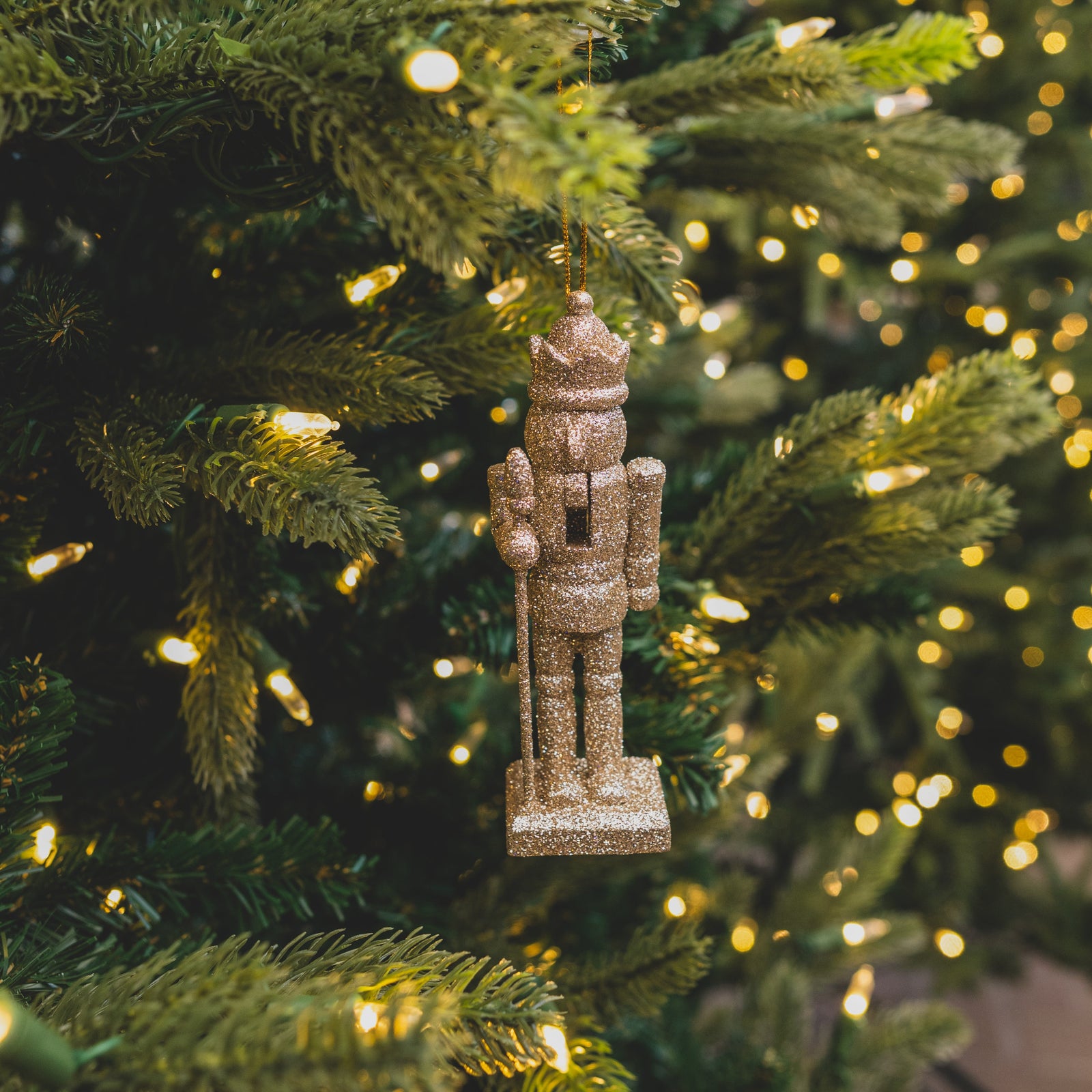 Shimmer Nutcracker Ornament Champagne