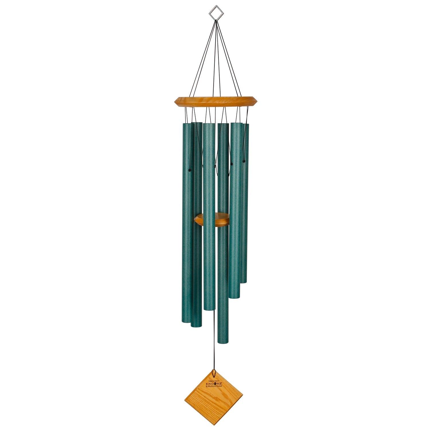 Beautifully crafted with cherry finish wood and six verdigris aluminum tubes, this windchime measures 37 inches long and 7 inches in diameter. It's a charming addition to any outdoor space, providing soothing sounds and a touch of elegance.