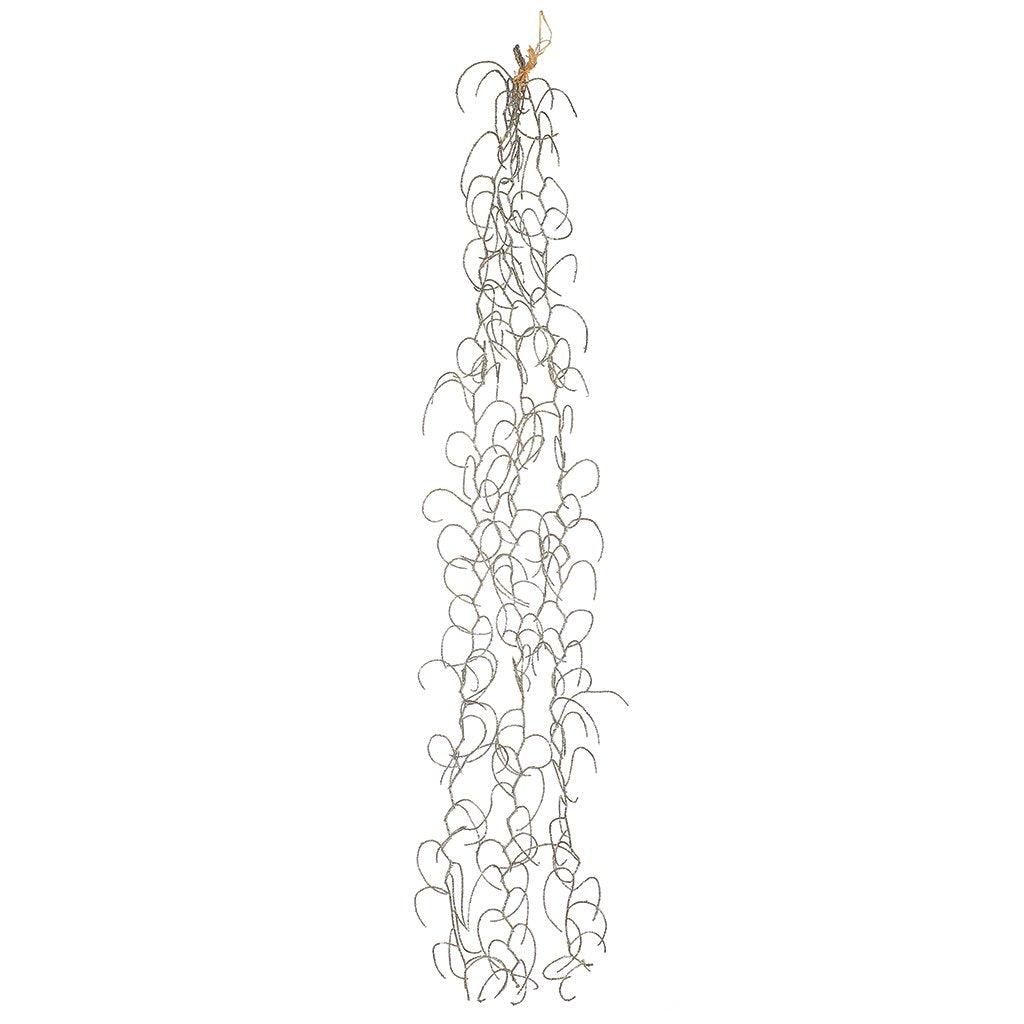 Elevate your décor with the Champagne Spanish Moss Vine, a delicate and enchanting addition that measures 32 inches in length. This decorative vine offers a touch of rustic elegance to your space. Whether used to adorn your holiday displays or as a year-round accent, the subtle champagne hue and feathery texture of this Spanish moss vine bring a unique charm to any setting.