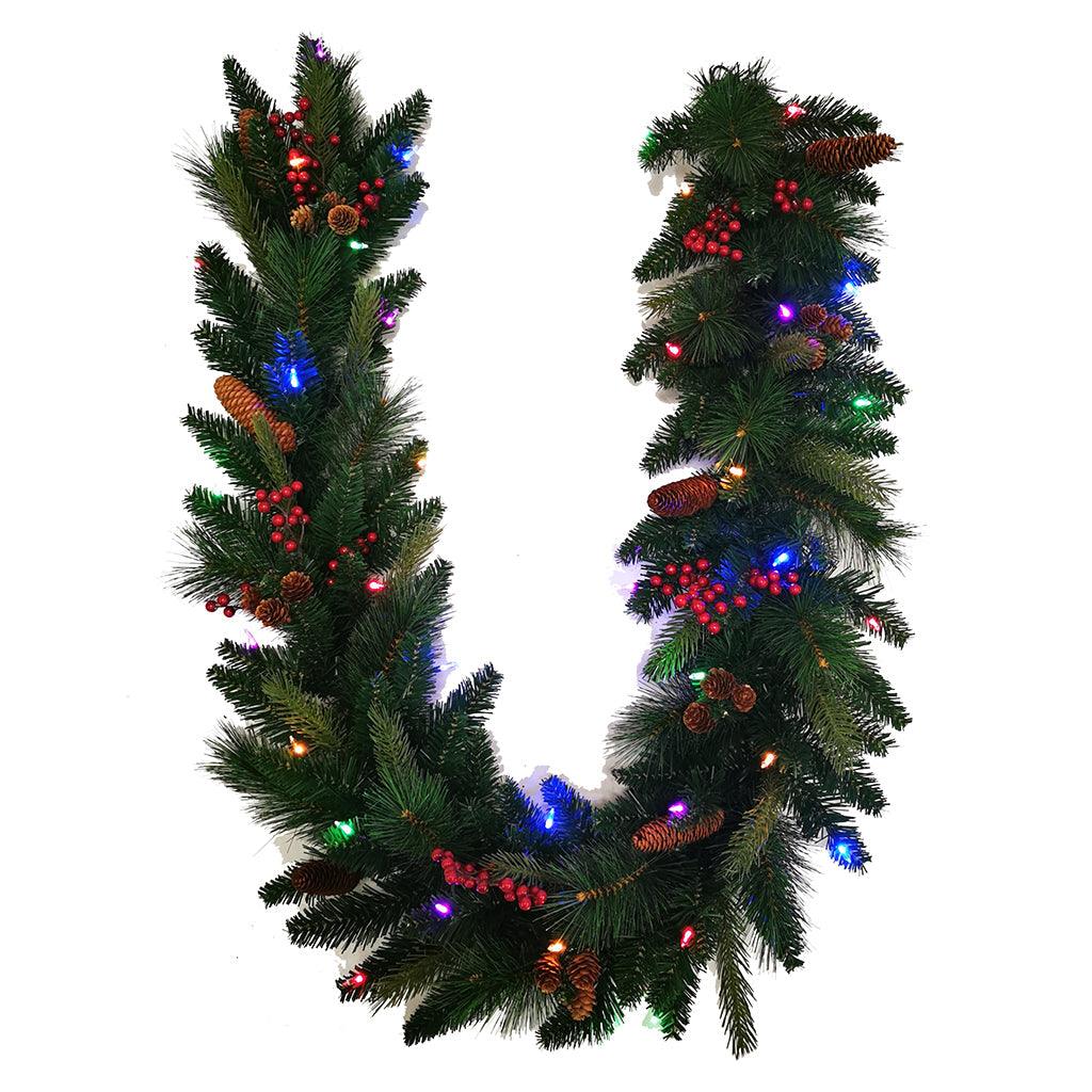 Illuminate your holiday season with this charming 6-foot Cone and Berry Pre-lit Garland. This exquisite pre-lit garland comes to life with its warm and inviting lights, making it a perfect addition to your festive décor. The combination of natural-looking pine cones and rich red berries adds a touch of rustic charm to your holiday setting. Whether it adorns your staircase, frames your doorway, or graces your mantel, this pre-lit garland will infuse your home with a cozy and welcoming ambiance.