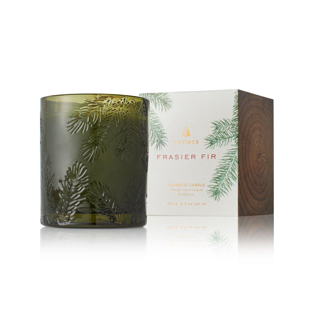 Experience the essence of a forest in the comfort of your home with the Frasier Fir Poured Candle in a beautifully molded green glass container. This 6.5 oz candle captures the fresh, invigorating fragrance of Frasier Fir, instantly transporting you to a serene woodland. The green glass adds a touch of rustic charm and complements the natural appeal of the pine-scented candle. 