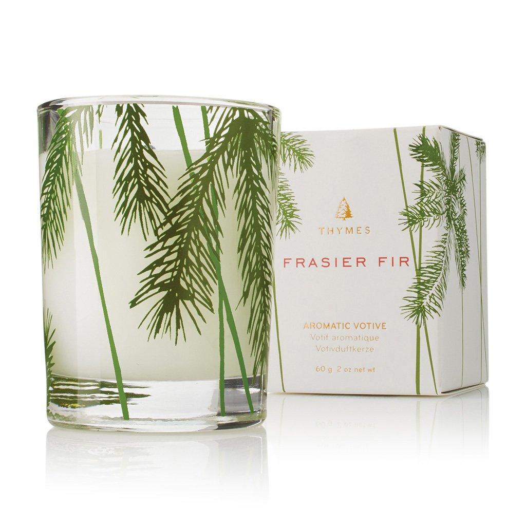 This 2.0 oz candle features a charming pine needle design that pays homage to the natural beauty of the Frasier Fir tree. As you light the candle, the unmistakable scent of Frasier Fir fills the air, evoking memories of crisp winter days and holiday cheer. Whether you place it on your dining table, mantle, or in your bathroom, this votive candle adds a touch of seasonal charm to any room