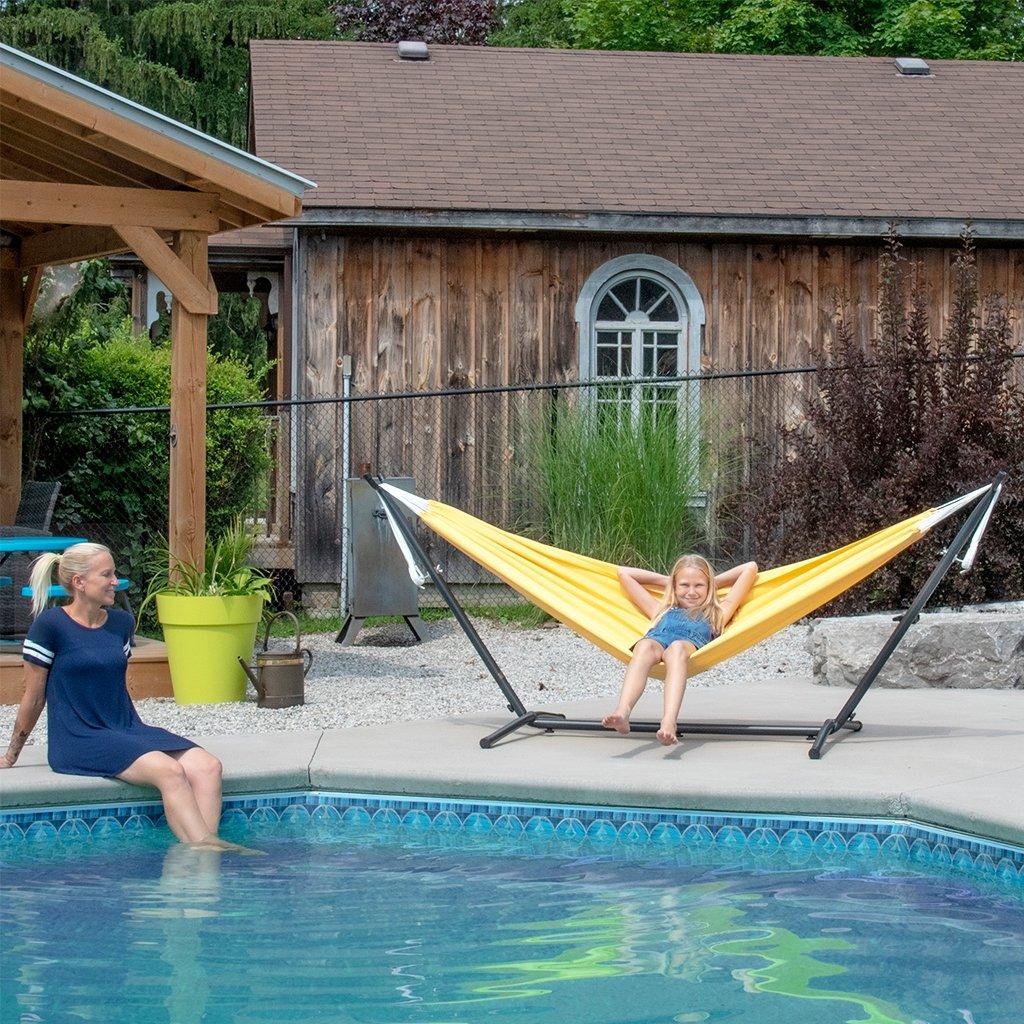 This nine-foot polyester hammock combo in sunny yellow is the ideal addition to any outdoor living space. Boasting the perfect balance of strength and comfort, you'll be basking in the warmth of the sun in no time.