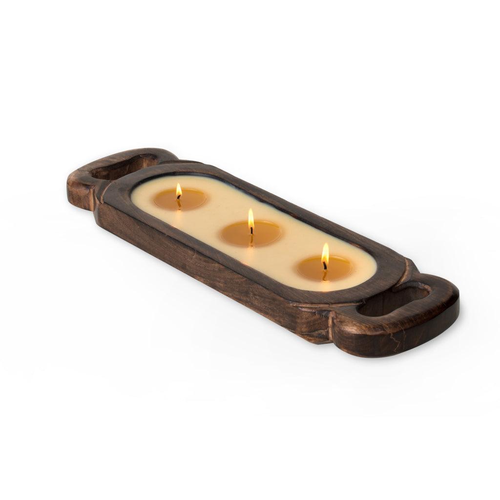 Indulge in the comforting warmth of the Himalayan 3-Wick Candle Tray, infused with the refreshing Grapefruit Pine scent, presented in a 32oz candle. The tray, with its charming antiqued appearance, is a testament to artisan craftsmanship. It is hand-hewn and intricately carved from a single piece of sustainable mango wood, rendering each tray a unique masterpiece. 