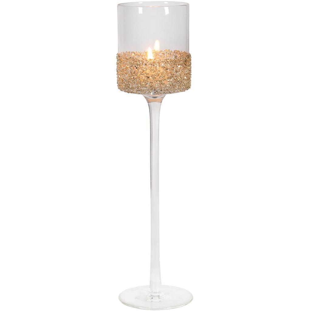 This stunning piece stands tall at 12 inches, making it a captivating addition to your home décor. Crafted from clear glass, it provides a clear view of the tealight's gentle glow, creating a warm and inviting ambiance. The standout feature is the gold glass glitter band that adds a touch of sophistication and glamour to this candle holder.