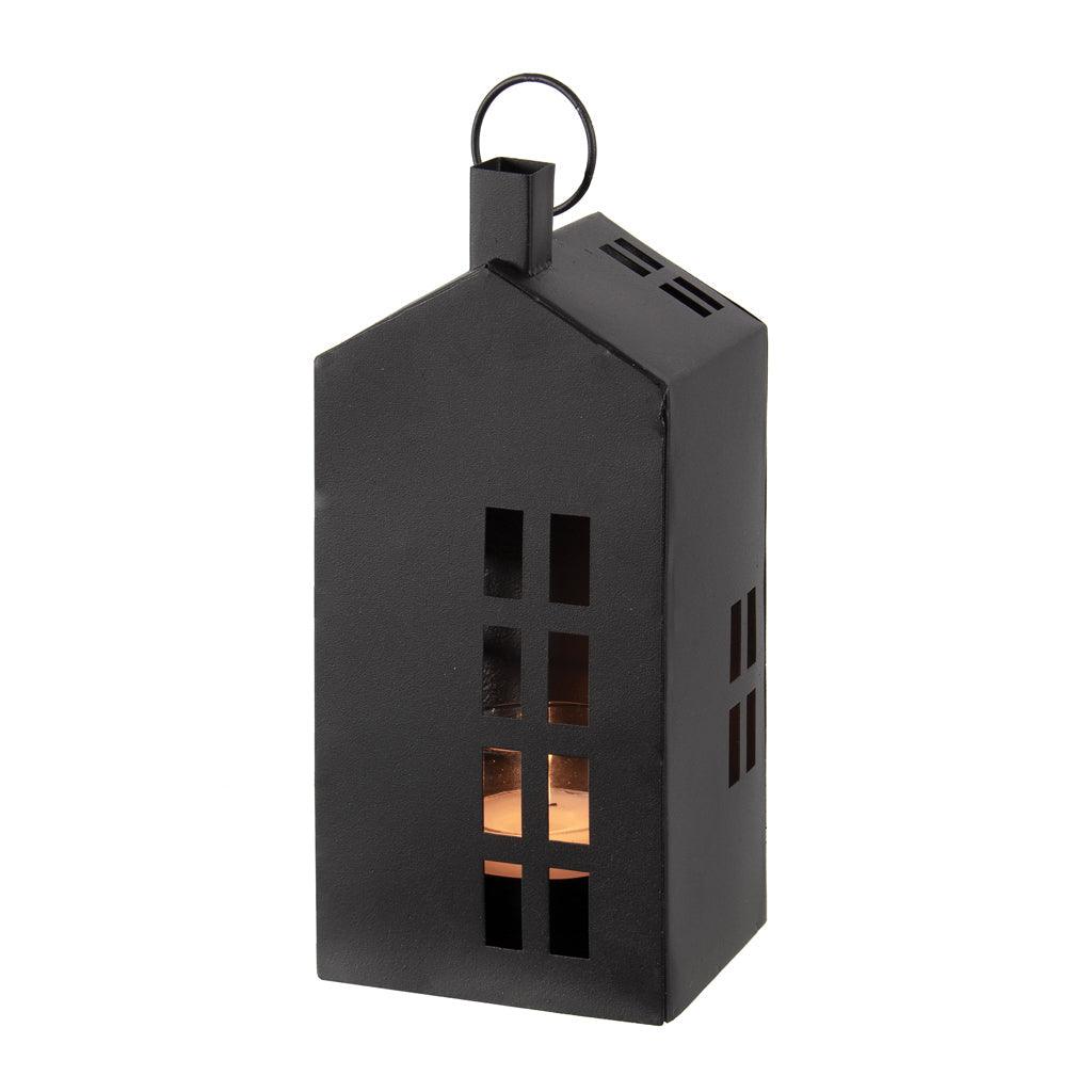 This tall lantern, standing at 8.75 inches in height, is crafted from durable black powder-coated metal. Its elegant design resembles a charming house, making it a decorative piece that also serves a functional purpose. Measuring 3.75 x 3.25 x 8.75 inches, it&#39;s perfectly sized to hold your favorite tealight candle.