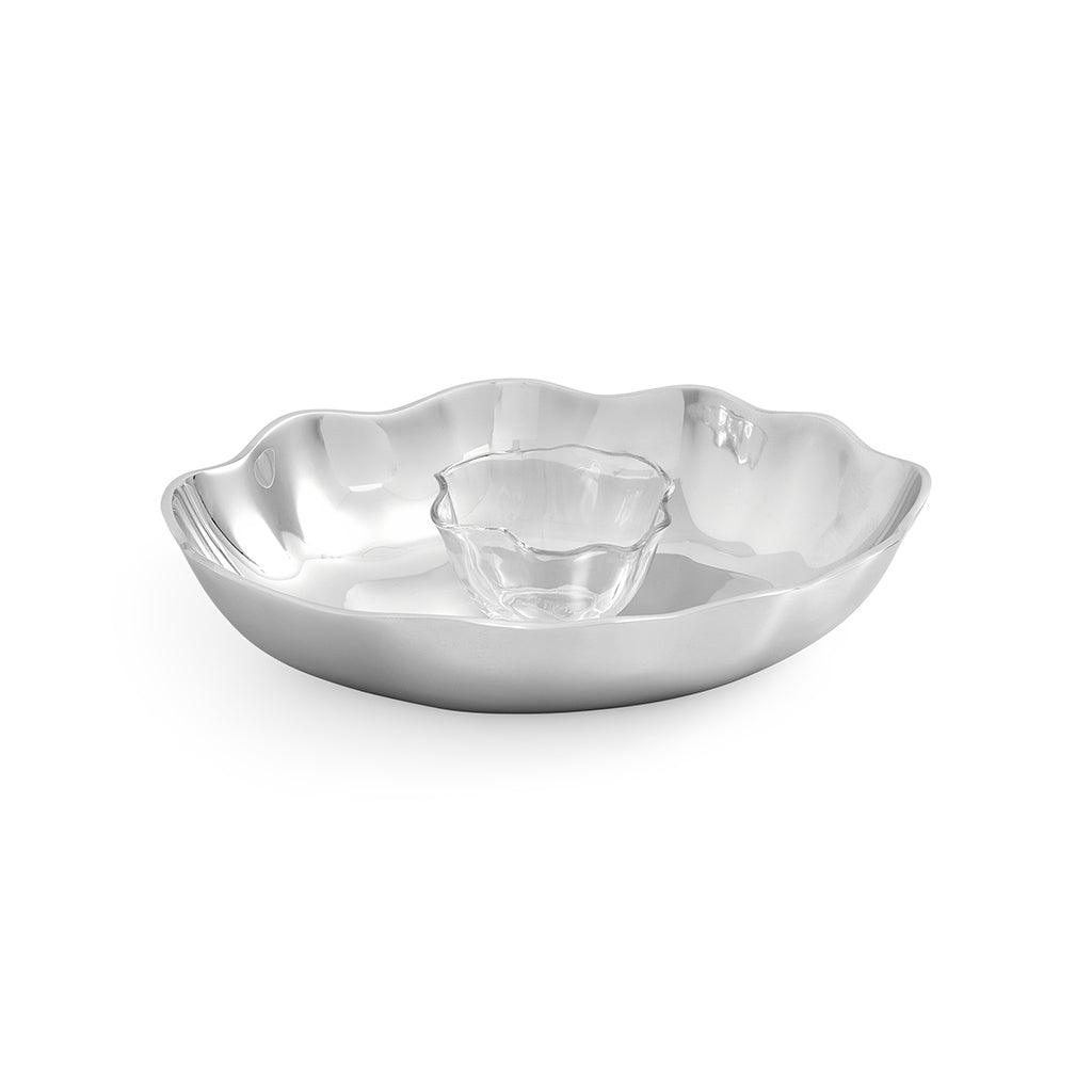The eye-catching combination of metal and glass enhances any table setting. The dip bowl sits comfortably on the metallic chip tray; simply warm or chill before serving.